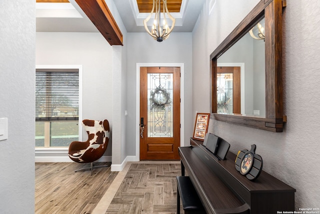 entrance foyer with a notable chandelier