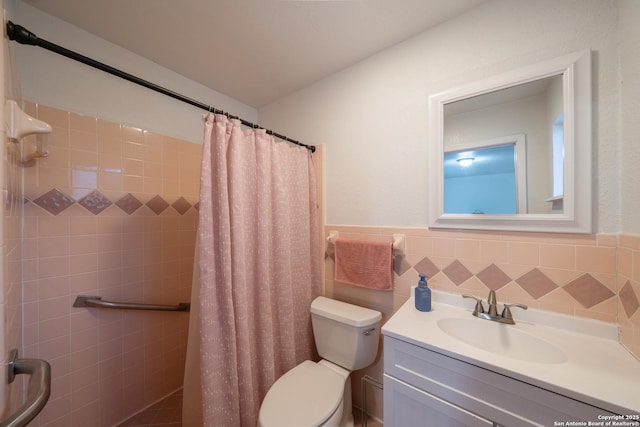 bathroom with toilet, vanity, and a shower with curtain