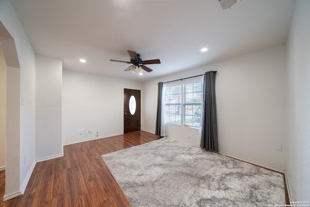 entryway featuring ceiling fan and dark hardwood / wood-style floors