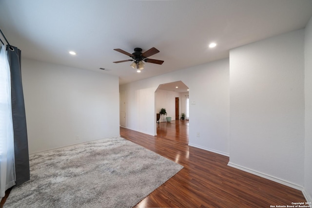 interior space featuring ceiling fan and dark wood-type flooring