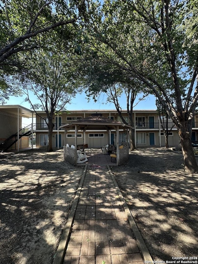 view of front of home featuring a pergola and a patio area