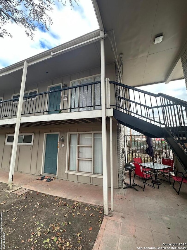 back of property featuring a patio area