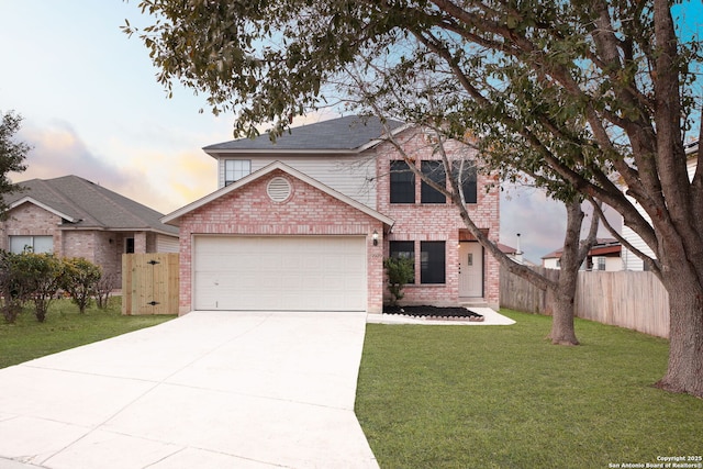 front of property featuring a garage and a lawn