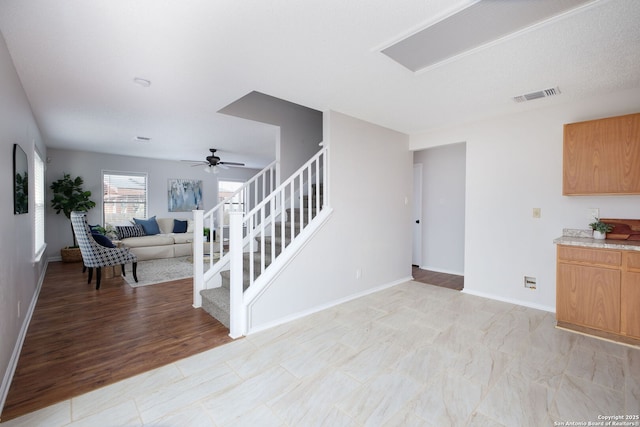 interior space with ceiling fan and light hardwood / wood-style flooring