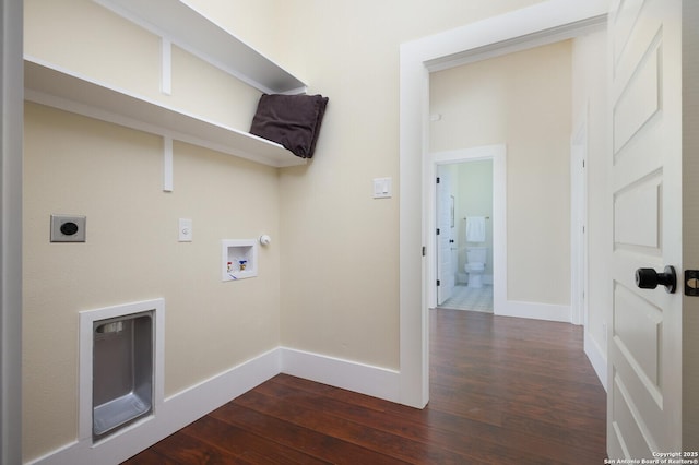 washroom featuring washer hookup, dark hardwood / wood-style flooring, hookup for a gas dryer, and electric dryer hookup