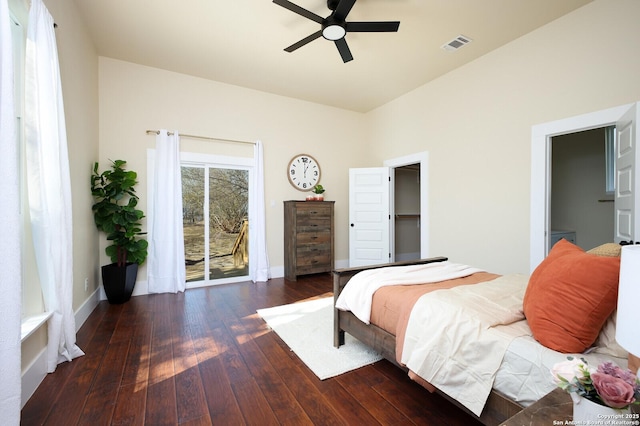 bedroom with dark hardwood / wood-style flooring, access to exterior, and ceiling fan