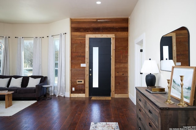 entryway with dark wood-type flooring