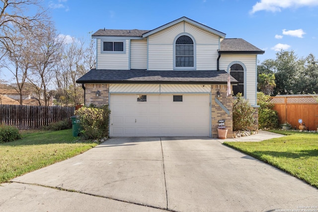 front of property with a front lawn and a garage