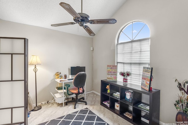 carpeted home office with a textured ceiling, ceiling fan, and vaulted ceiling