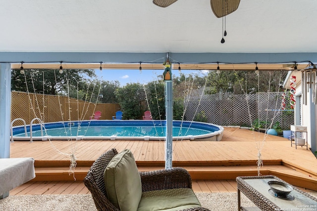 view of swimming pool featuring a deck