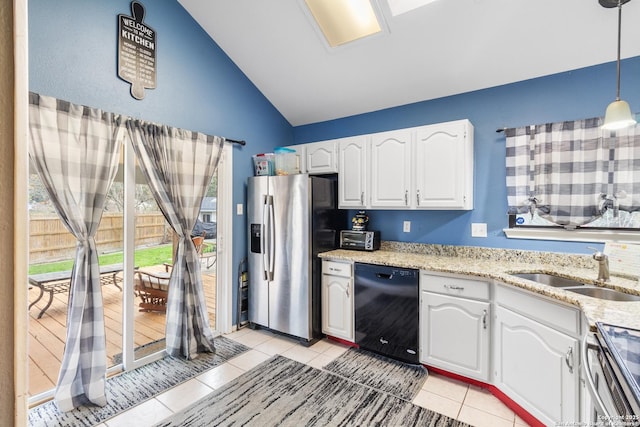 kitchen featuring sink, white cabinetry, vaulted ceiling, hanging light fixtures, and appliances with stainless steel finishes