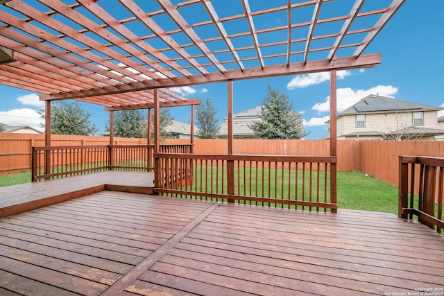 wooden deck with a pergola and a yard