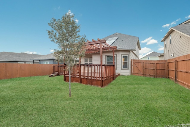 back of house featuring a yard, a pergola, and a wooden deck