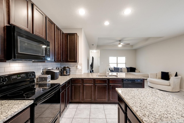 kitchen featuring sink, black appliances, backsplash, ceiling fan, and dark brown cabinetry