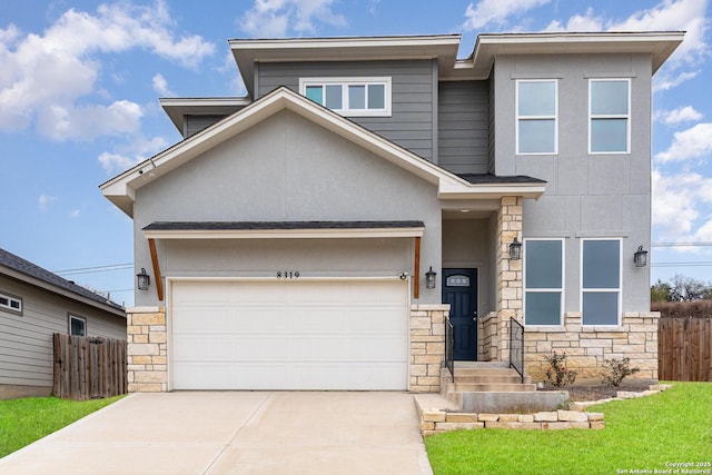 view of front of house featuring stone siding, fence, concrete driveway, and stucco siding