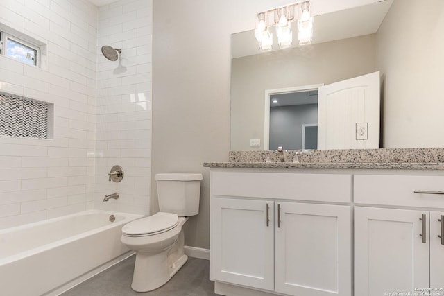 full bathroom featuring toilet, tiled shower / bath combo, and vanity