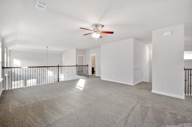 carpeted empty room featuring ceiling fan