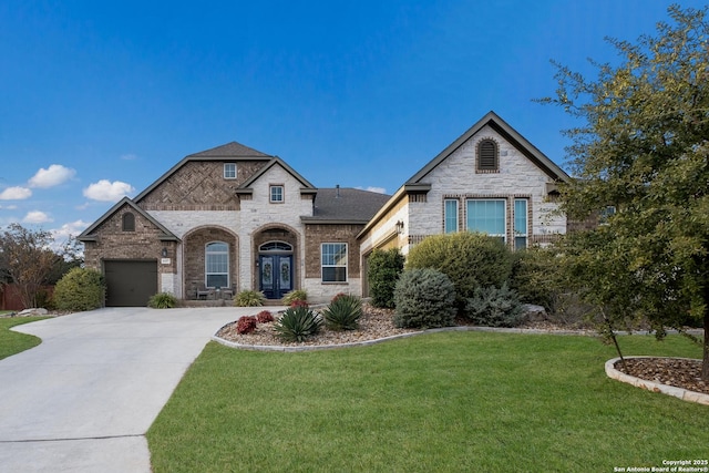 view of front of house featuring a garage and a front yard