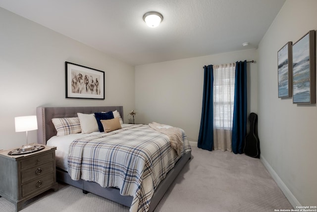 bedroom with light carpet