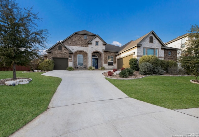 french provincial home with a garage and a front yard