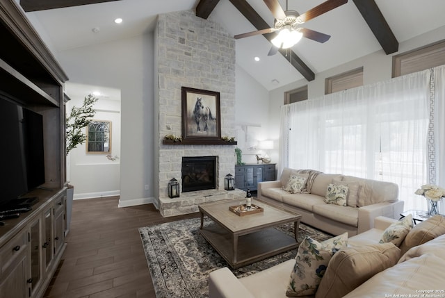 living room featuring high vaulted ceiling, a fireplace, ceiling fan, dark wood-type flooring, and beam ceiling