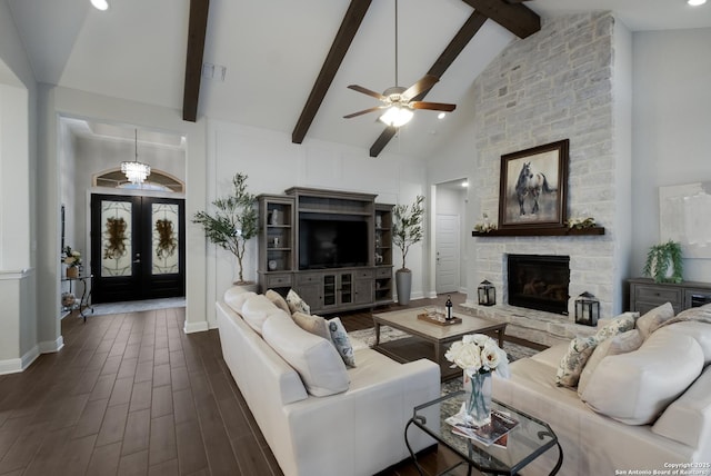 living room featuring dark wood-type flooring, high vaulted ceiling, a fireplace, french doors, and beamed ceiling