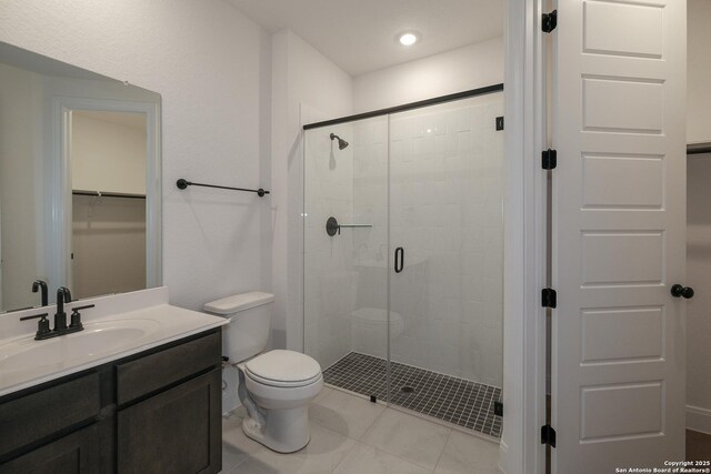 9314 Everly Crk, San Antonio, TX 78263 - full bathroom with a shower stall, toilet, tile patterned floors, recessed lighting, and vanity