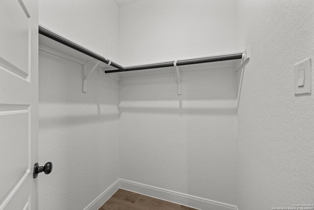 9314 Everly Crk, San Antonio, TX 78263 - spacious closet with dark wood-style floors