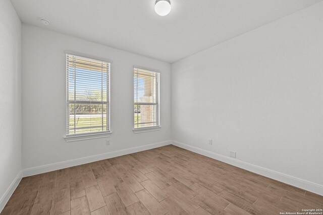 9314 Everly Crk, San Antonio, TX 78263 - unfurnished room with baseboards and wood finished floors