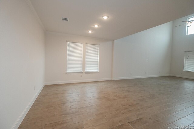 9314 Everly Crk, San Antonio, TX 78263 - unfurnished room with crown molding, recessed lighting, baseboards, light wood finished floors, and visible vents