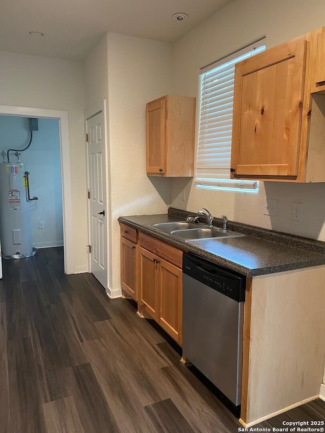 kitchen featuring stainless steel dishwasher, light brown cabinetry, dark hardwood / wood-style flooring, water heater, and sink