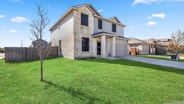 view of front of home with a front lawn and a garage