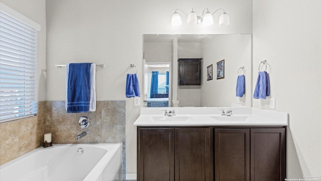 bathroom featuring a bathing tub and vanity