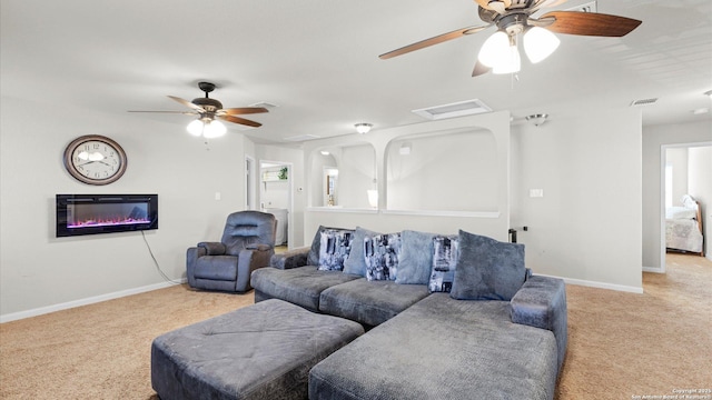 carpeted living room featuring ceiling fan