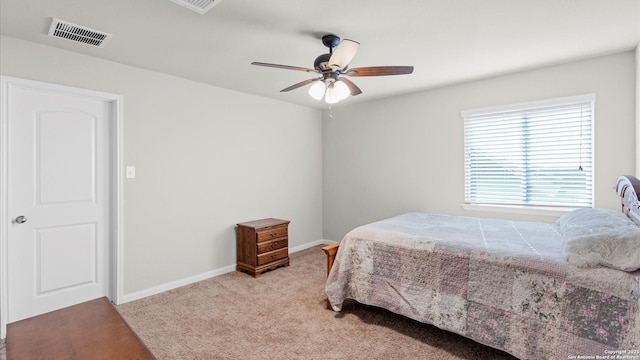 bedroom featuring light carpet and ceiling fan