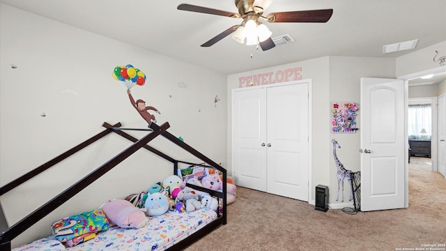 carpeted bedroom with a closet and ceiling fan