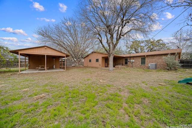 view of yard with central AC and a patio area