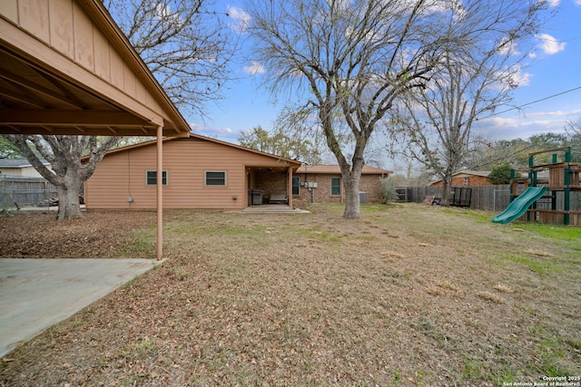 view of yard with a patio area and a playground