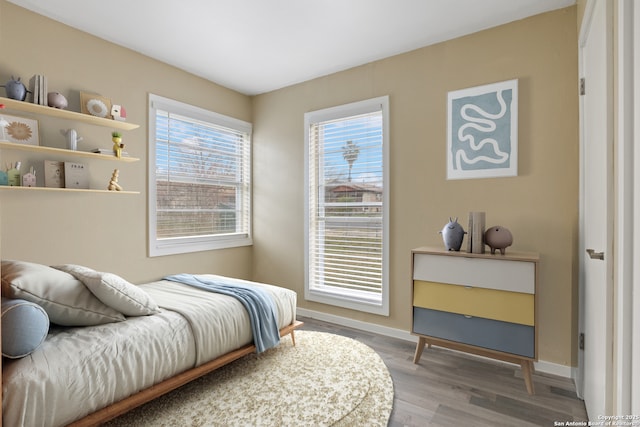 bedroom with hardwood / wood-style flooring