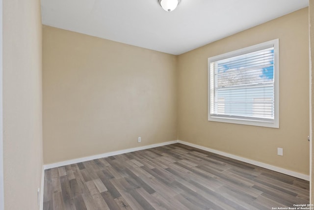 spare room featuring hardwood / wood-style flooring