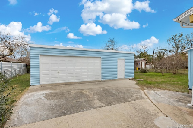 garage featuring a yard