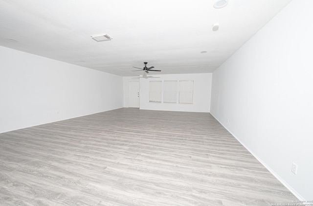 spare room with ceiling fan and light hardwood / wood-style flooring