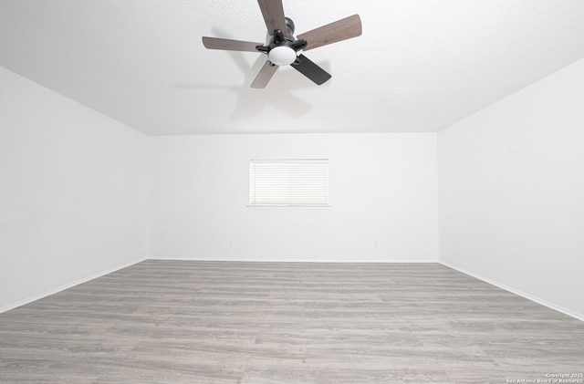 unfurnished room featuring light hardwood / wood-style floors and ceiling fan