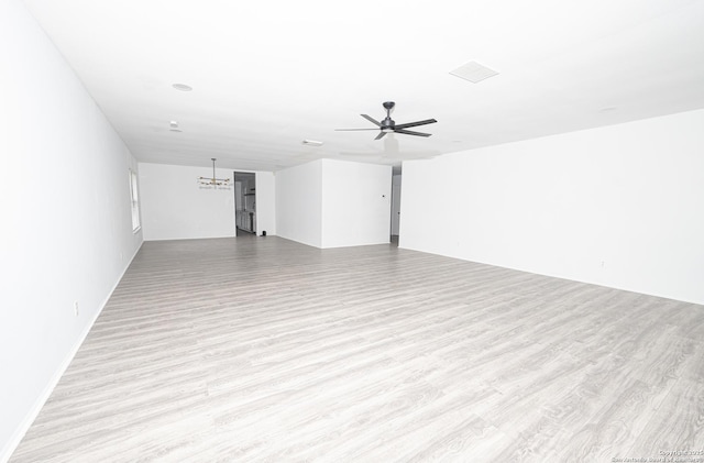 spare room with ceiling fan and light hardwood / wood-style flooring