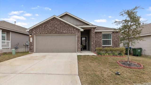 view of front of home featuring a front yard and a garage