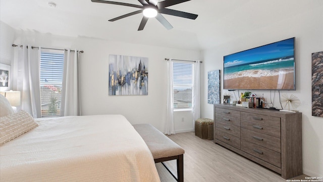 bedroom featuring light wood-type flooring and ceiling fan