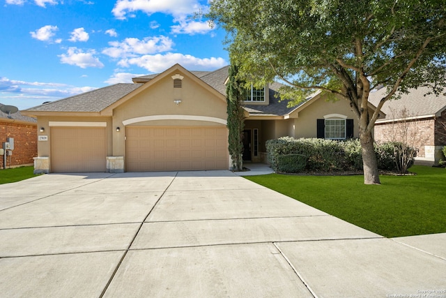 view of front of house with a front lawn and a garage