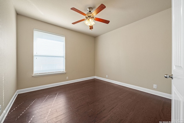 unfurnished room with ceiling fan and dark hardwood / wood-style flooring