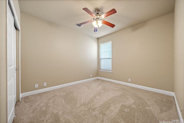 unfurnished room featuring light colored carpet