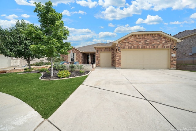 ranch-style house with a garage and a front lawn